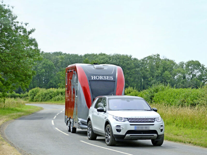 Car towing a horse trailer